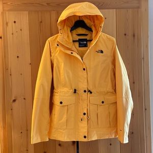 The North Face Women’s size Medium yellow hooded waterproof jacket like new